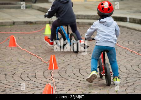 Baby Boy on Balance Bike with Cones as Track Stock Photo