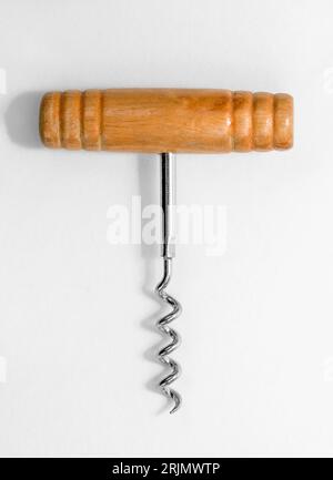 Wine corkscrew with wooden handle on white background. Stock Photo
