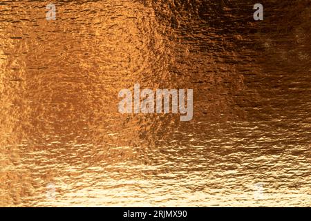 Abstract Defocused Gold foil texture background. Stock Photo