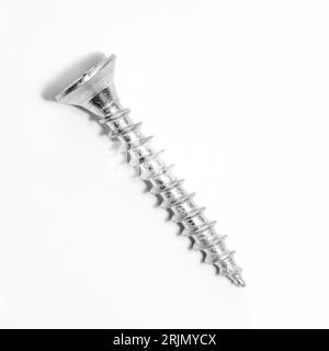 Closeup of metal screw with shadow on white background. Stock Photo
