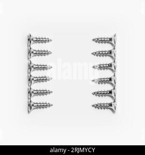 Studio photography of a screws with cross hands on white. Stock Photo