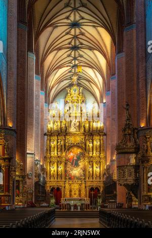 Beautiful golden and ornate altar of Church of the Assumption of the Blessed Virgin Mary, Cathedral Basilica in Pelplin, Poland Stock Photo
