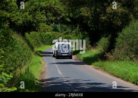 Car and trailer on country lane in East Yorkshire, England UK Stock Photo