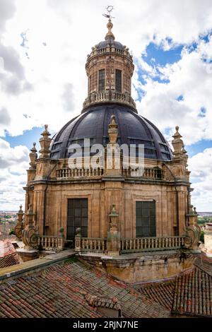 Baroque style bell tower and dome of La Clerecía building in Salamanca, Spain with decorative carved facade. Stock Photo