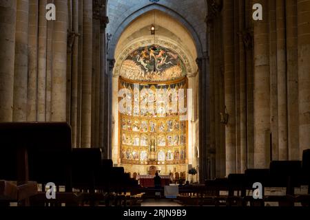 Salamanca, Spain, 06.10.21. The main altarpiece of the Old Cathedral (Catedral Vieja) in Salamanca with the main nave view and benches. Stock Photo