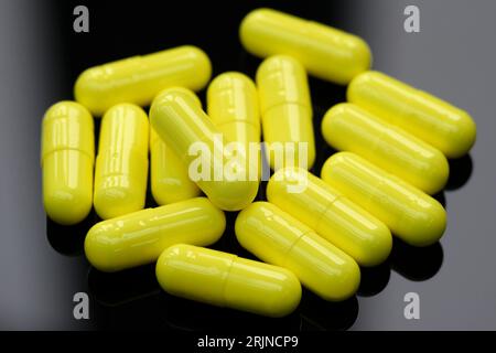 Yellow Medical capsules. Stock Photo