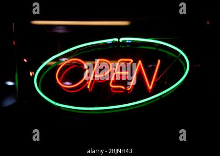 Green neon light shaped into the French word meaning OPEN in English  Stock Photo - Alamy