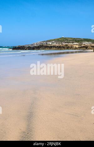 A view over Fistral Beach to Towan Headland on the coast of Newquay in Cornwall in the UK. Stock Photo