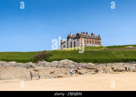 The imposing historic Headland Hotel overlooking Fistral Beach in Newquay in Cornwall in the UK. Stock Photo