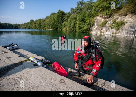 Svobodne Hermanice, Czech Republic. 23rd Aug, 2023. Fifteen divers dived successively in the flooded quarry Sifr in Svobodne Hermanice, Bruntal region, Czech Republic, August 23. 2023. After surfacing they all underwent a heart examination. Doctors are trying to find links in the results of the examinations of the individuals, who all undergo the same dive. They are trying to find out whether decompression events can be prevented in the future. Credit: Vladimir Prycek/CTK Photo/Alamy Live News Stock Photo