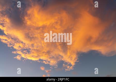 Beautiful orange cloud in the sky at sunset, sky remplacement, nature background Stock Photo
