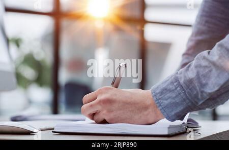 man working making notes in his planner Stock Photo