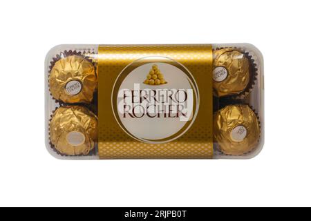 Box of Ferrero Rocher chocolates isolated on white background - whole hazelnut in milk chocolate and nut croquante Stock Photo