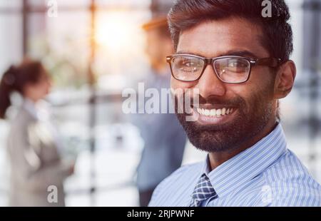 concentrated businessman with beard wearing glasses portrait Stock Photo