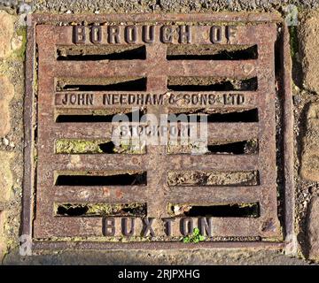 Borough of Buxton cast iron embossed grid, made by John Needham & sons ltd, Stockport, High Peak, Derbyshire, England, SK17 6XN Stock Photo
