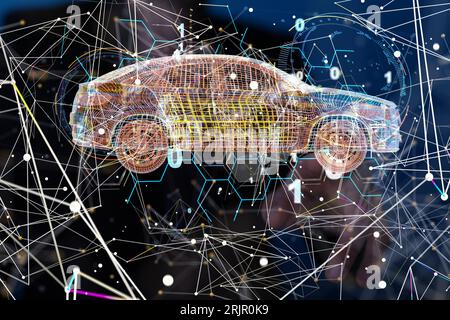 A person navigating a hologram of an orange and yellow car blueprint Stock Photo