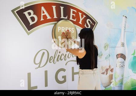 EDITORIAL USE ONLY Nesli Aksu at Baileys ‘Press for the Unexpected’ pop-up event, which is offering free samples of the brand’s latest release ‘Baileys Deliciously Light’ as well as ‘cake or not’ treats from Extreme Cake Makers, London. Picture date: Wednesday August 23, 2023. Stock Photo