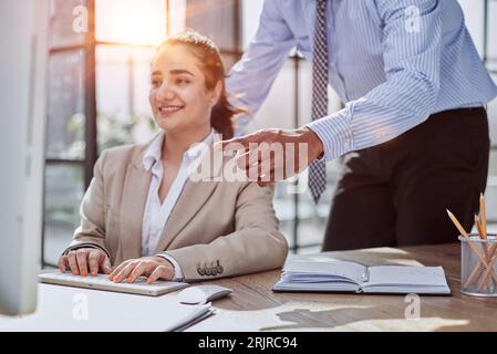 Group of business people and software developers working as a team in office Stock Photo