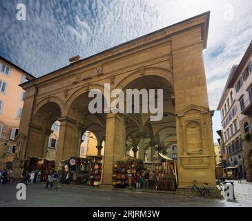 Florence - Porcellino market  in Florence. On the lively Porcellino market, bags, clothes, shoes are sold Stock Photo