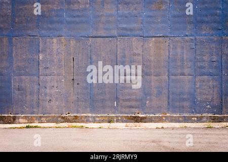 View of a textured background of cement slabs in shades of blue. Concept backgrounds, templates, textures, graphic resources. Stock Photo