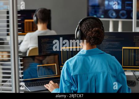 Young computer programmers working on desktop PC in office Stock Photo
