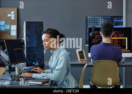 Young computer programmers coding on computer in office Stock Photo