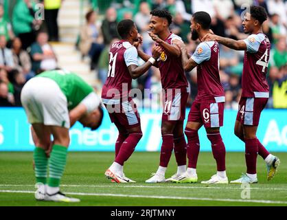 Aston Villa's Ollie Watkins (centre) celebrates scoring their side's first goal of the game with team-mates during the first leg of the UEFA Europa Conference League play off match at Easter Road, Edinburgh. Picture date: Wednesday August 23, 2023. Stock Photo
