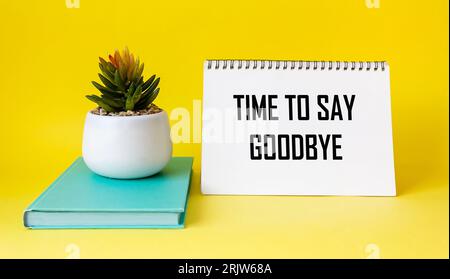 Time to say goodbye. Message on notepad and yellow background. Conceptual image. Stock Photo