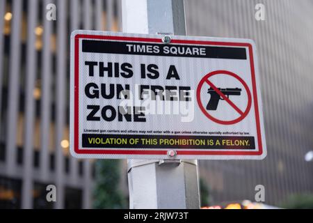 New York, New York, USA. 22nd Aug, 2023. A gun prohibition sign at the entrance to Times Square. The NYPD installed these signs after New York's strict gun laws were struck down by the Supreme Court, citing 2nd Amendment constitutional infringements conducted by New York authorities in the gun permit process.Times Square is a popular tourist destination and is home to the New Year's Eve ball drop ceremony, but is infamously avoided by locals due to being a tourist trap. Several companies with offices in Times Square include Reuters, ABC News, Morgan Stanley and Barclays. (Credit I Stock Photo