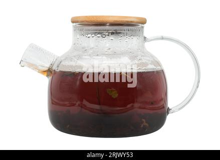 Glass teapot with large tea leaves on a white background. Tea. tonic drink Stock Photo