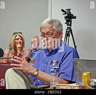 MARION, KANSAS - AUGUST 21, 2023 Eric Meyer the publisher of the Marion County Record newspaper sitting at the press table during the city council meeting Stock Photo