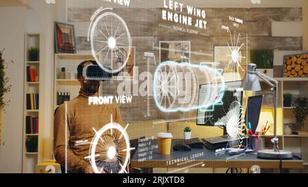 Cad engineer manufacturing machine product components on pc using augmented reality technology, working on industrial machinery production assisted by creative engineering software Stock Photo