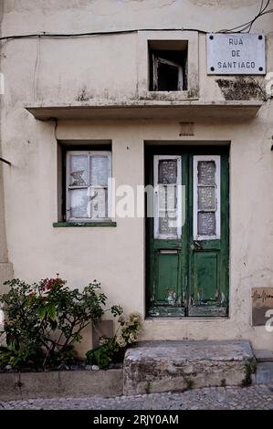 Green door and windows in Lisbon, Portugal Stock Photo