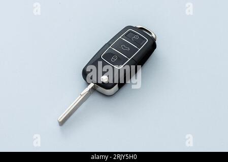 Wireless car key on the blue background. Stock Photo