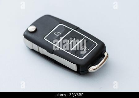 Wireless car key on the blue background. Stock Photo