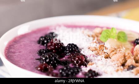 Blueberry smoothie with banana, cococnut and blackberries. Stock Photo