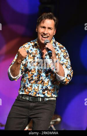 Henley On Thames, UK. 20th Aug, 2023. Nathan Moore of Brother Beyond performs on stage during the Rewind Festival South 2023, at Temple Island Meadows. Credit: SOPA Images Limited/Alamy Live News Stock Photo
