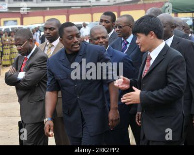 Bildnummer: 53233467  Datum: 31.07.2009  Copyright: imago/Xinhua (090731) -- KINSHASA, July 31, 2009 (Xinhua) -- Joseph Kabila (C Front), president of the Democratic Republic of Congo (DR Congo), listens to the introduction of a representative of China Communications Construction Group Company Ltd. in Kinshasa, capital of DR Congo, July 31, 2009. Joseph Kabila on Friday attended the opening ceremony of the reconstruction of Lumumba Street in Kinshasa, to be implemented by the Chinese company. (Xinhua/Shu Shi) (dzl) (1)DR CONGO-JOSEPH KABILA-LUMUMBA STREET-RECONSTRUCTION  PUBLICATIONxNOTxINxCHN Stock Photo