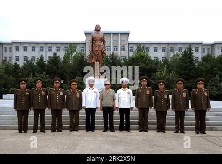 (090812) -- PYONGYANG, Aug. 12, 2009 (Xinhua) -- The undated photo released on Aug. 12, 2009 by the Korean Central News Agency (KCNA) shows Kim Jong Il (C), top leader of the Democratic People s Republic of Korea (DPRK), posing with military officers while inspecting Kim Jong Suk Naval University in South Hamgyong-do. (Xinhua/KCNA) (zcc) (1)DPRK-KIM JONG IL-KIM JONG SUK NAVAL UNIVERSITY  PUBLICATIONxNOTxINxCHN   090812 Pyongyang Aug 12 2009 XINHUA The undated Photo released ON Aug 12 2009 by The Korean Central News Agency KCNA Shows Kim Jong Il C Top Leader of The Democratic Celebrities S Repu Stock Photo