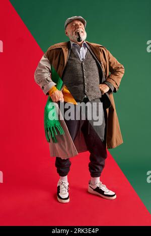 Creative collage of two halves of emotional retired grey-head man in various fashion style outfits expressing positive emotions Stock Photo
