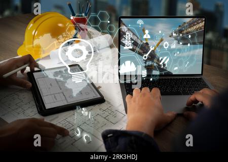 Engineer architect industry 4.0 using tablet construction site, industrial and innovation infographic at building futuristic architect control innovat Stock Photo