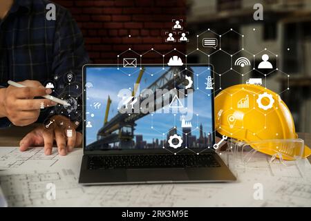 Engineer architect industry 4.0 using tablet construction site, industrial and innovation infographic at building futuristic architect control innovat Stock Photo