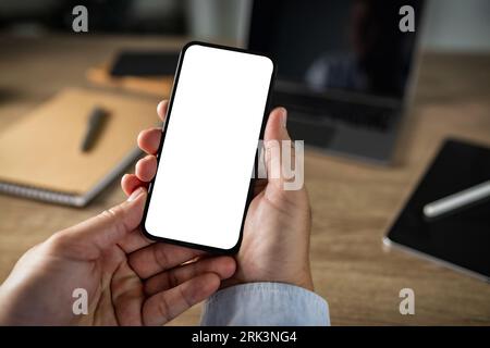 Man hand using phone with blank screen and modern frameless design and typing text message on smartphone communication smart digital Stock Photo