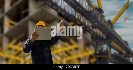 Construction man engineer professional industrial technician and analyze heavy industry and safety building concept project architect project outdoors Stock Photo