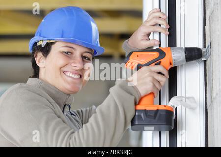 portrait of female construction worker using a cordless drill Stock Photo