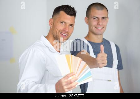 young house painter and decorator with thumbs up Stock Photo