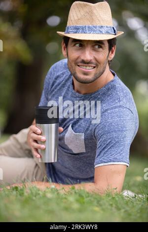 a handsome young man relaxing in the grass Stock Photo