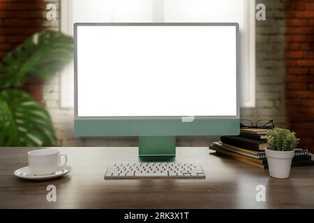 Businessman working using a desktop computer of the blank screen mockup image sitting at a comfortable workplace copyspace lifestyle portrait working Stock Photo
