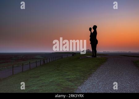 Two ladies waiting for the high tide Stock Photo