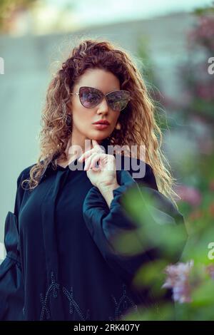 Arab women in traditional Designer Abaya Dress. Fashion Concept Stock Photo